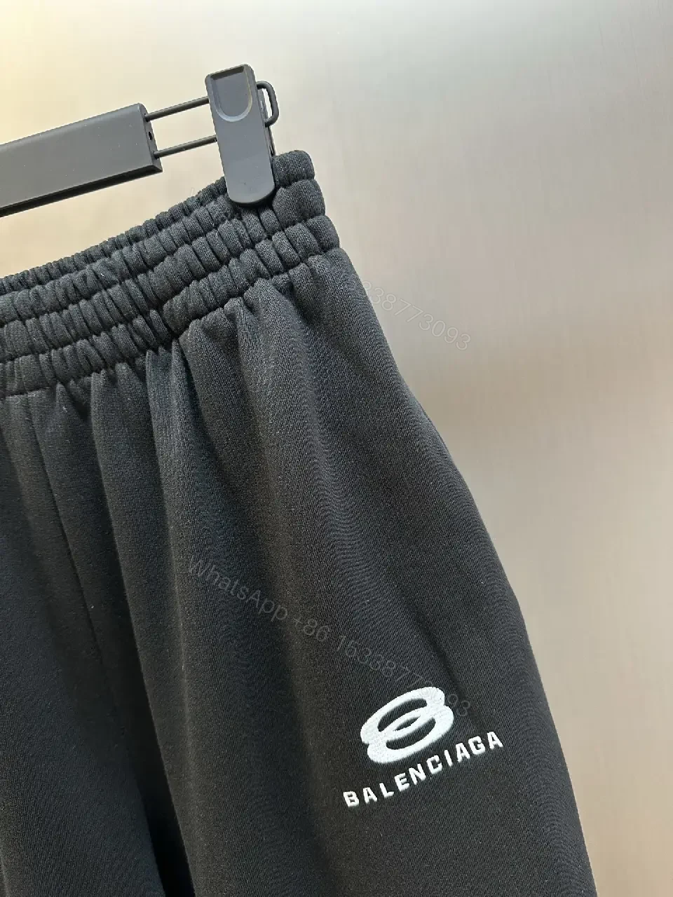 View 10 of Chic Black Wide-Leg Track Pants with Subtle Logo