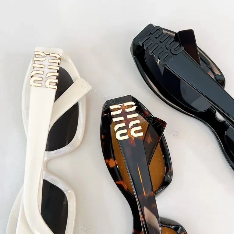 View 6 of Chic Black Miu Miu Sunglasses with Gold Accent - All-Day Shield