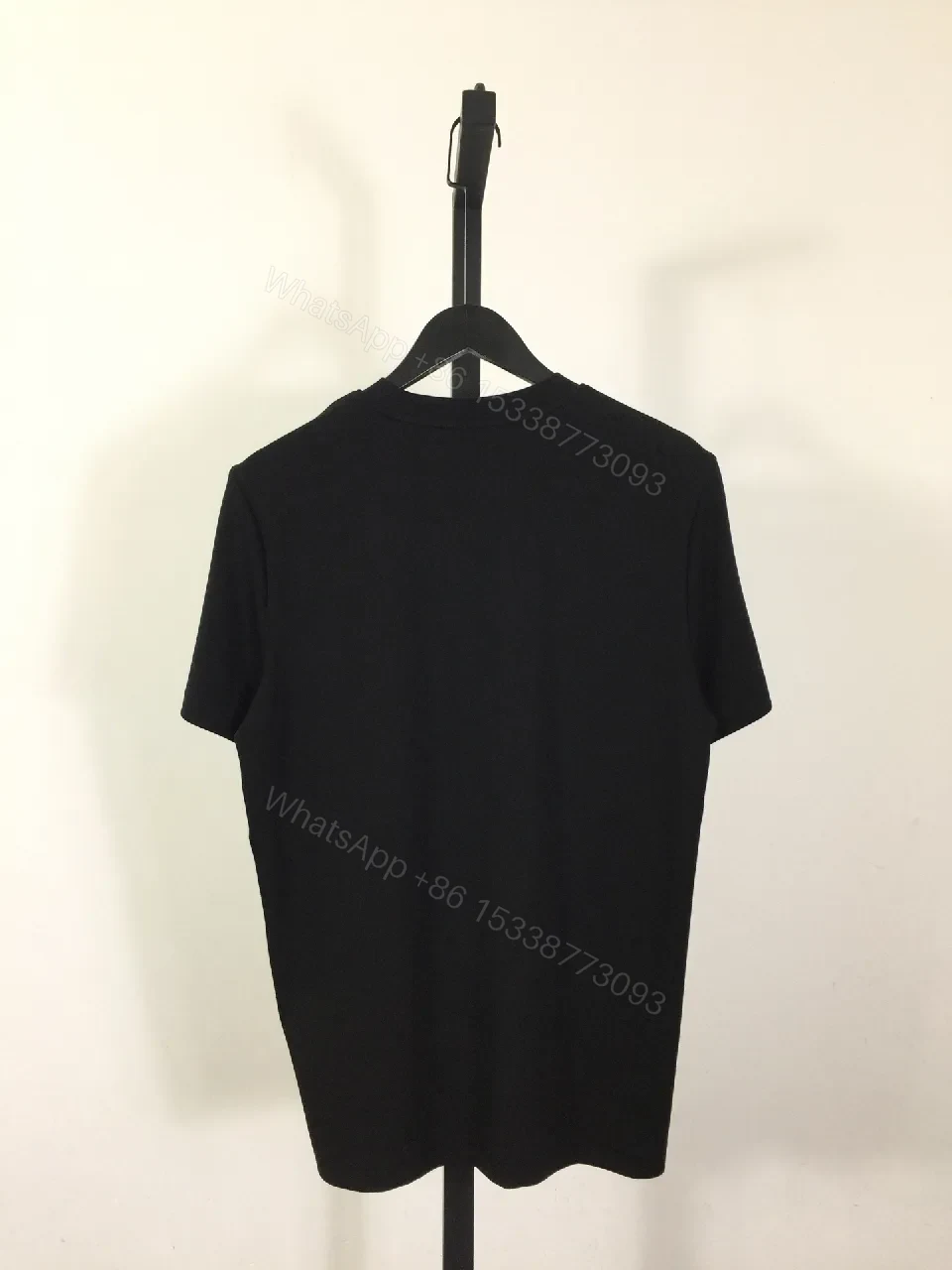 View 4 of Black Cotton T-Shirt + Minimalist Logo + Modern Crew Neck + Subtle Luxe Detail + T-Shirt