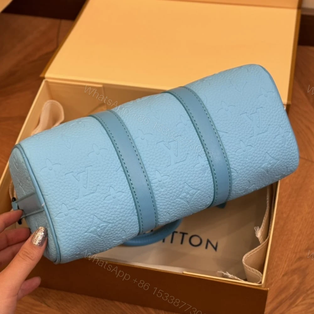 View 4 of Louis Vuitton Keepall Bandoulière 25 Turquoise 25Cm M11996