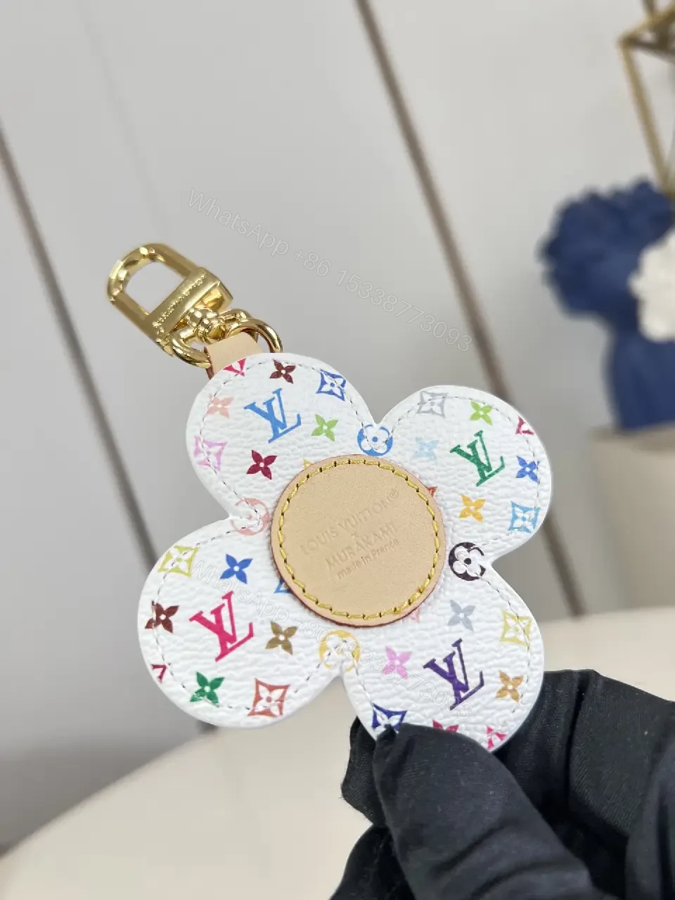 View 7 of White Leather-like Quilted Flower Keychain - LV Monogram Accent, Gold Hardware