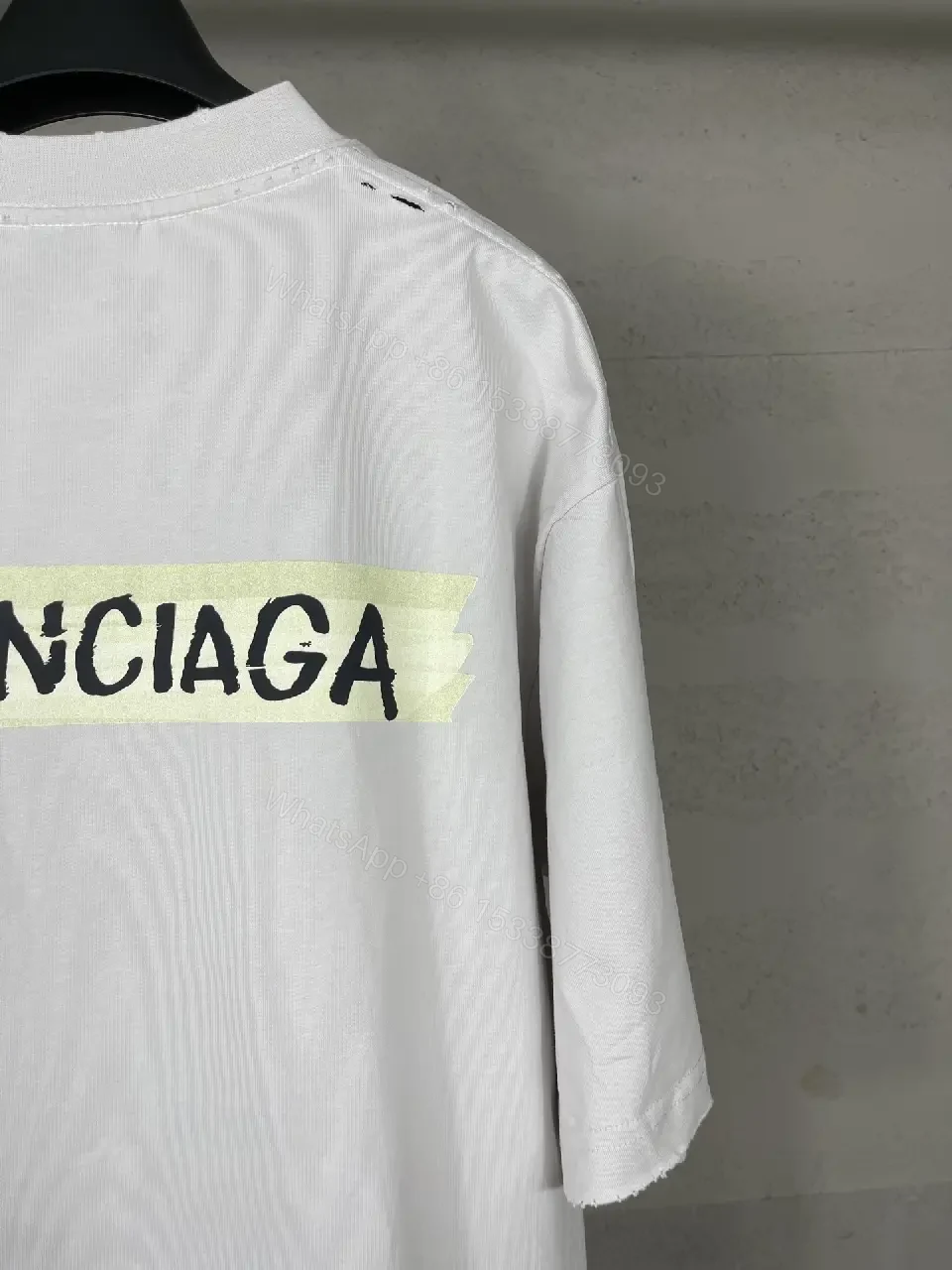 View 5 of Oversized White Tee with Signature Patch - Minimalist Luxe