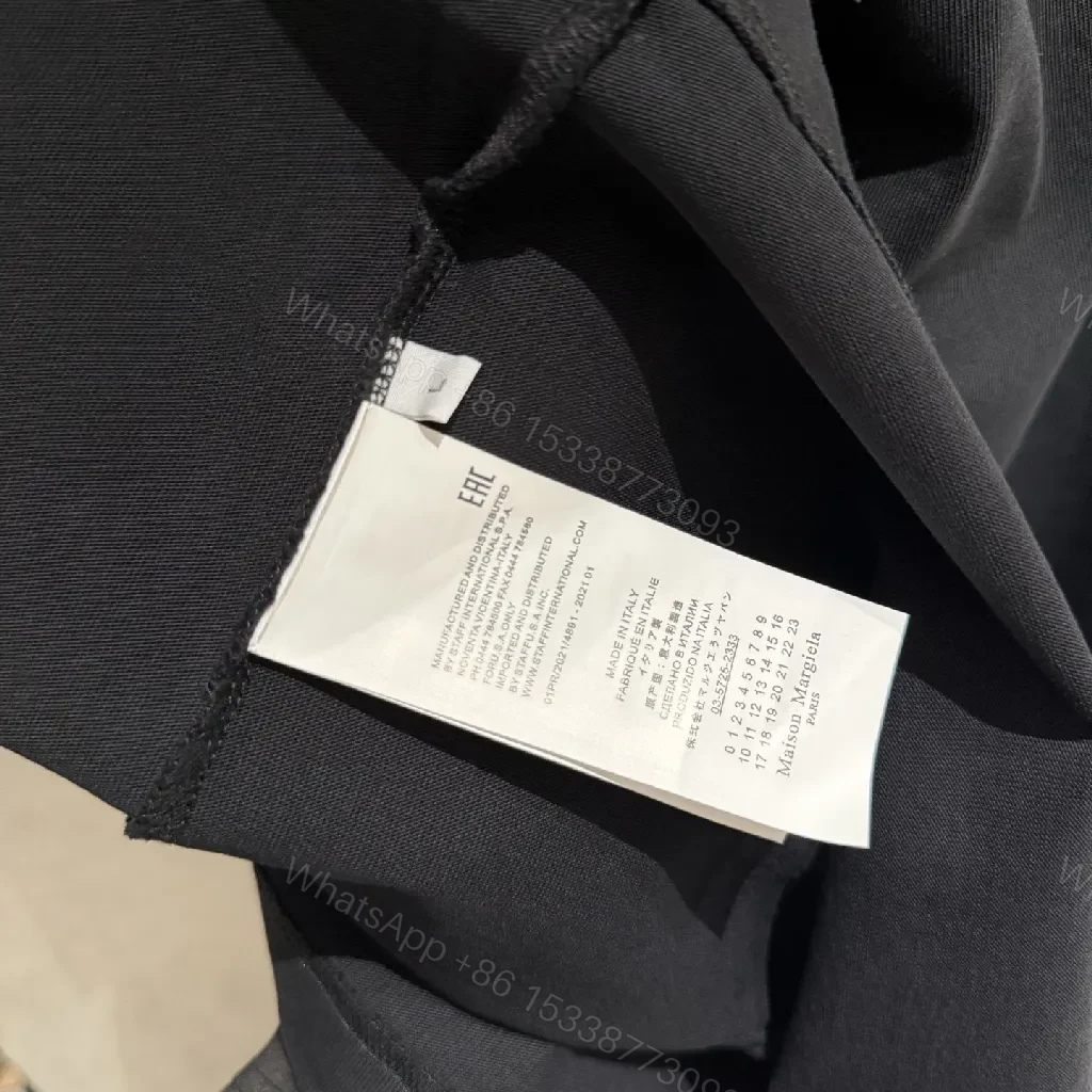 View 4 of Oversized Black Tee with Subtle Dot Logo — Luxe Everyday Wear