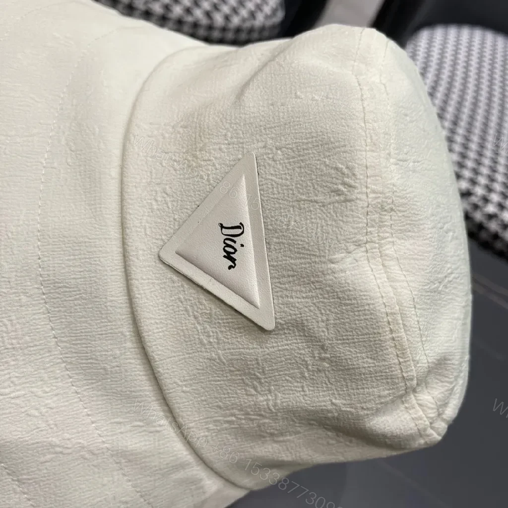 View 10 of Compact Luxury Bucket Hat with TriangleEmblem, Off-White, Textured Weave