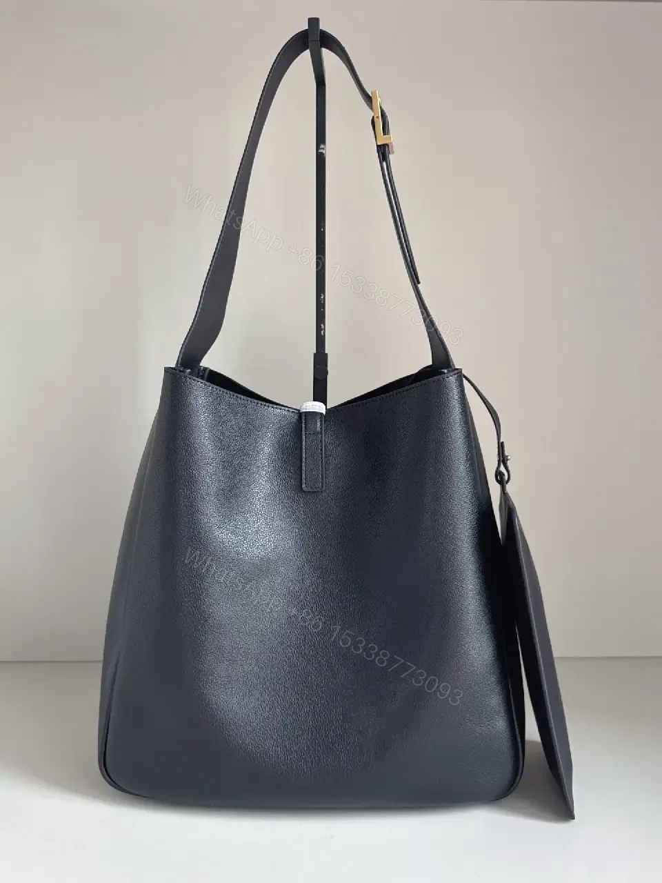 View 2 of Navy Leather Bucket Bag with Gold YSL Charm and Zippered Pocket