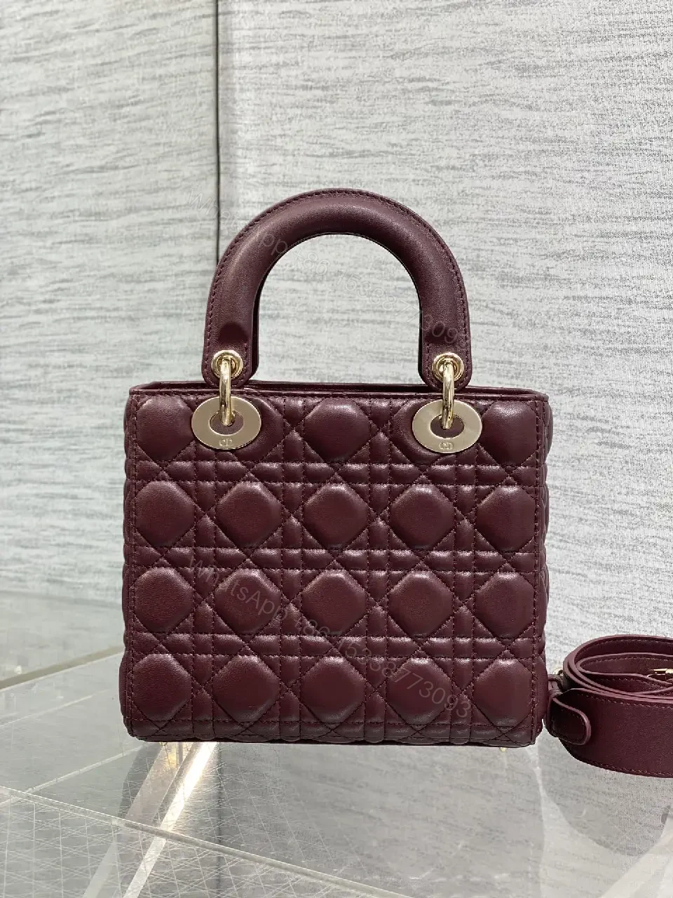 View 2 of Quilted Burgundy Handbag with Top Handles, Structured Charm