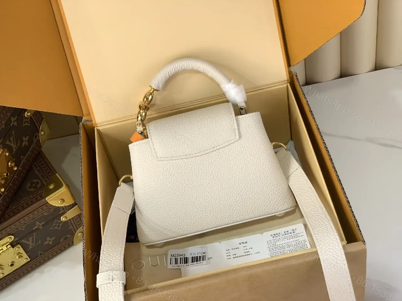 View 5 of Chic Textured Leather Mini Bag with Gold Emblem
