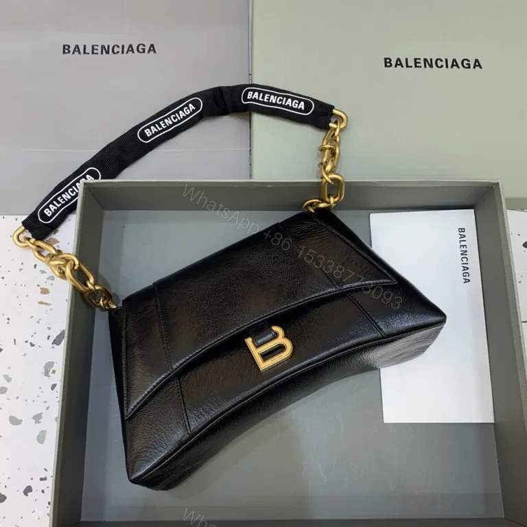 Chic Black Leather Crossbody with Bold Gold Hardware Bag — view 1
