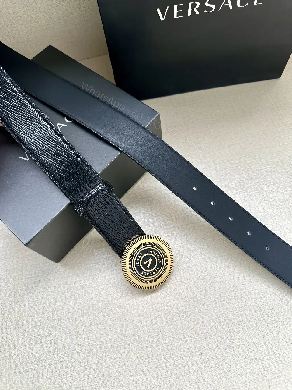 View 2 of Textured Leather Belt with Round Emblem Buckle – Luxe Minimalist Style