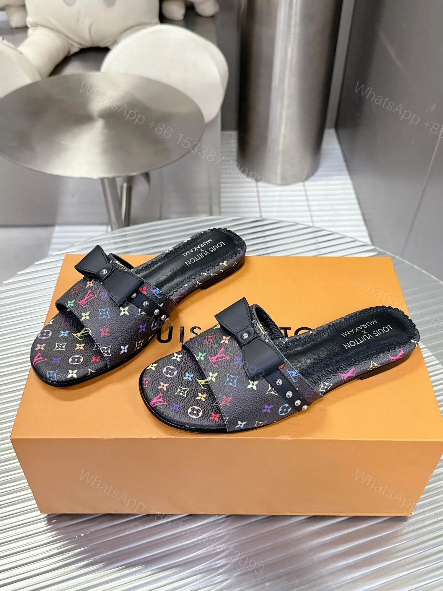 View 5 of LV Women Black Patterned Leather Bow Slide Sandals