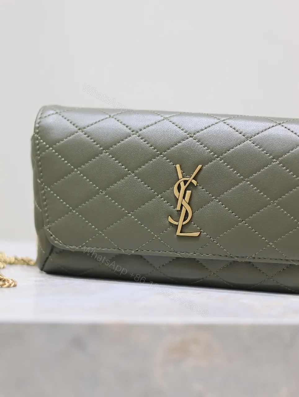 View 9 of Soft-Quilted Leather Clutch with Gold Emblem, Evening Style, Compact Luxury