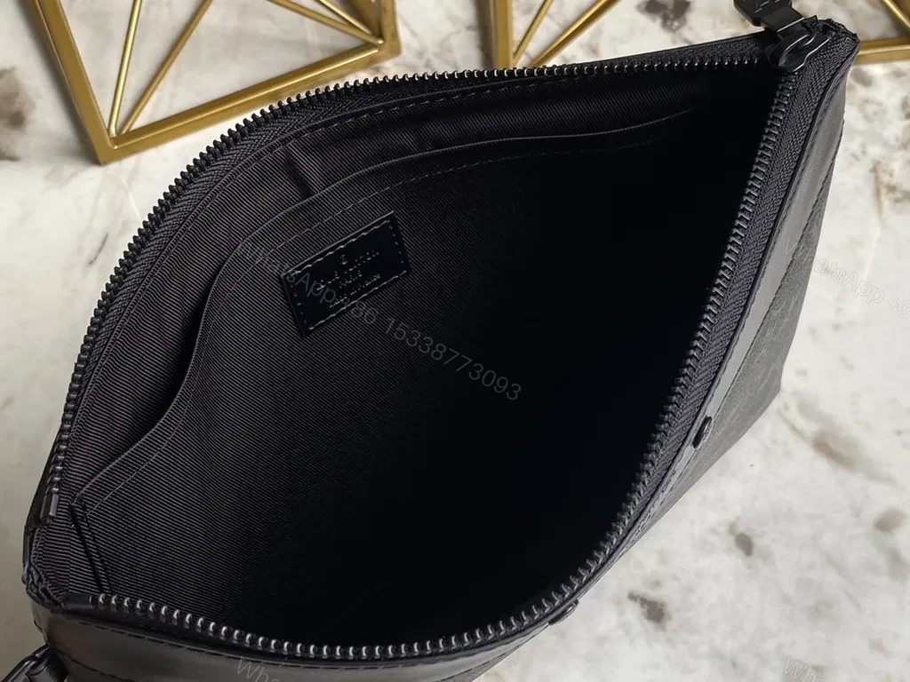 View 5 of Dark Monogram Clutch: Luxe Black Canvas, Leather Trim, Wrist Strap
