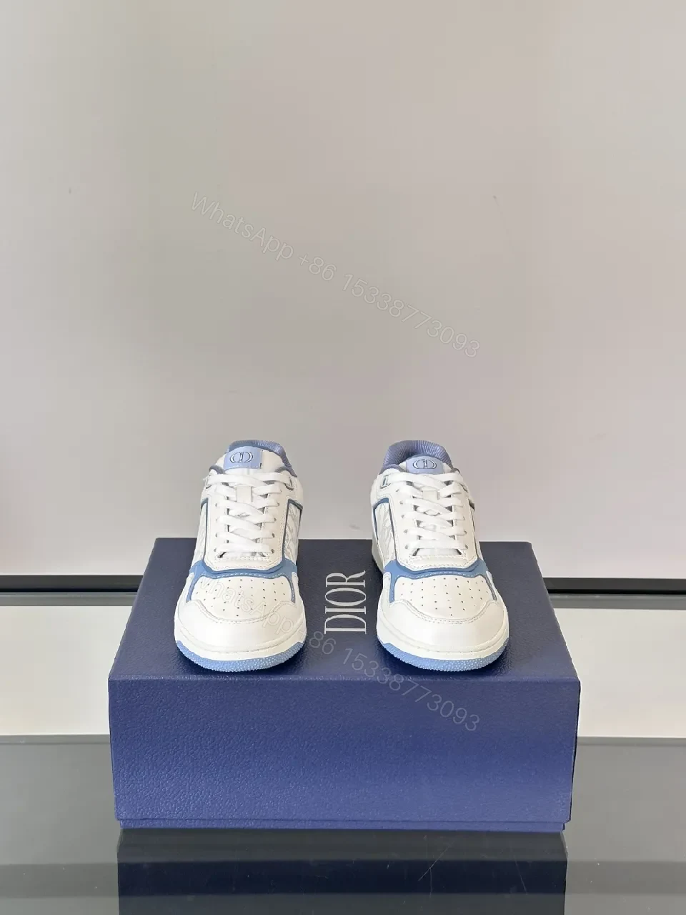 View 3 of White & Sky Blue Leather High-Tops with Subtle Monogram Texture