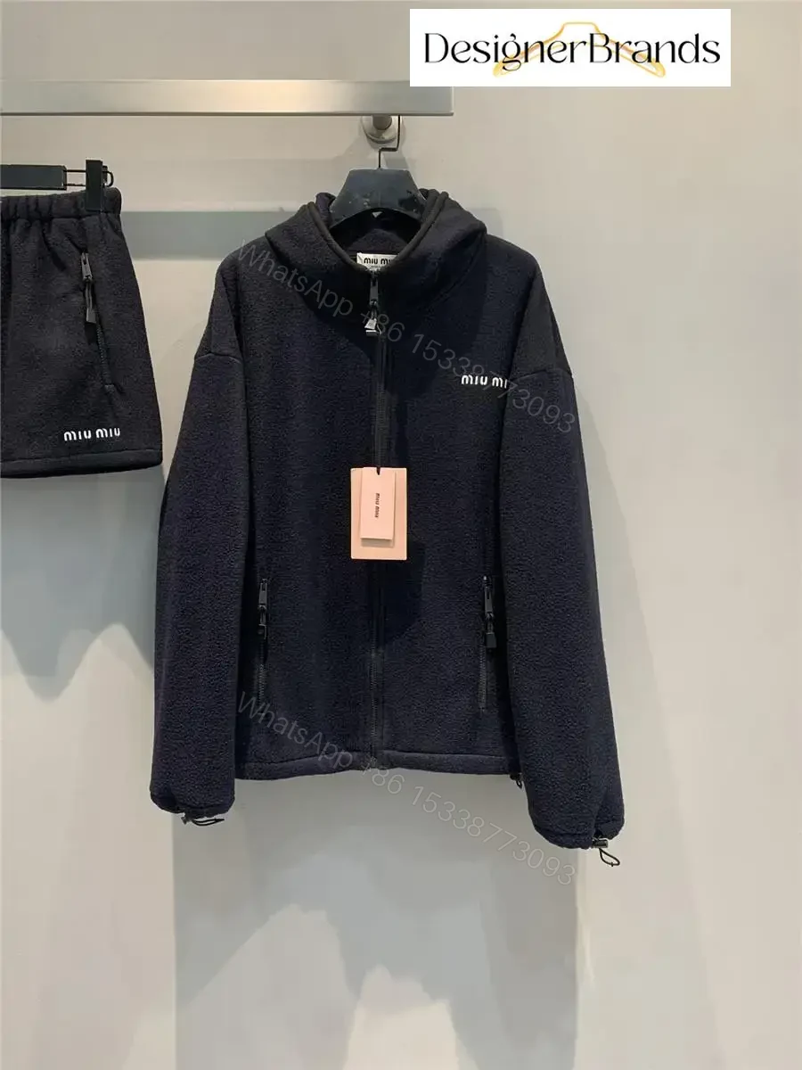 Cozy Black Fleece Jacket with Minimalist Luxe Logo, Unisex, Winter-ready — view 1
