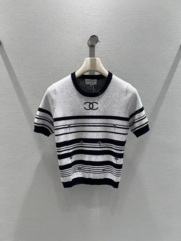 Chanel-Influenced Striped Knit Top with Subtle Embellishments — view 1