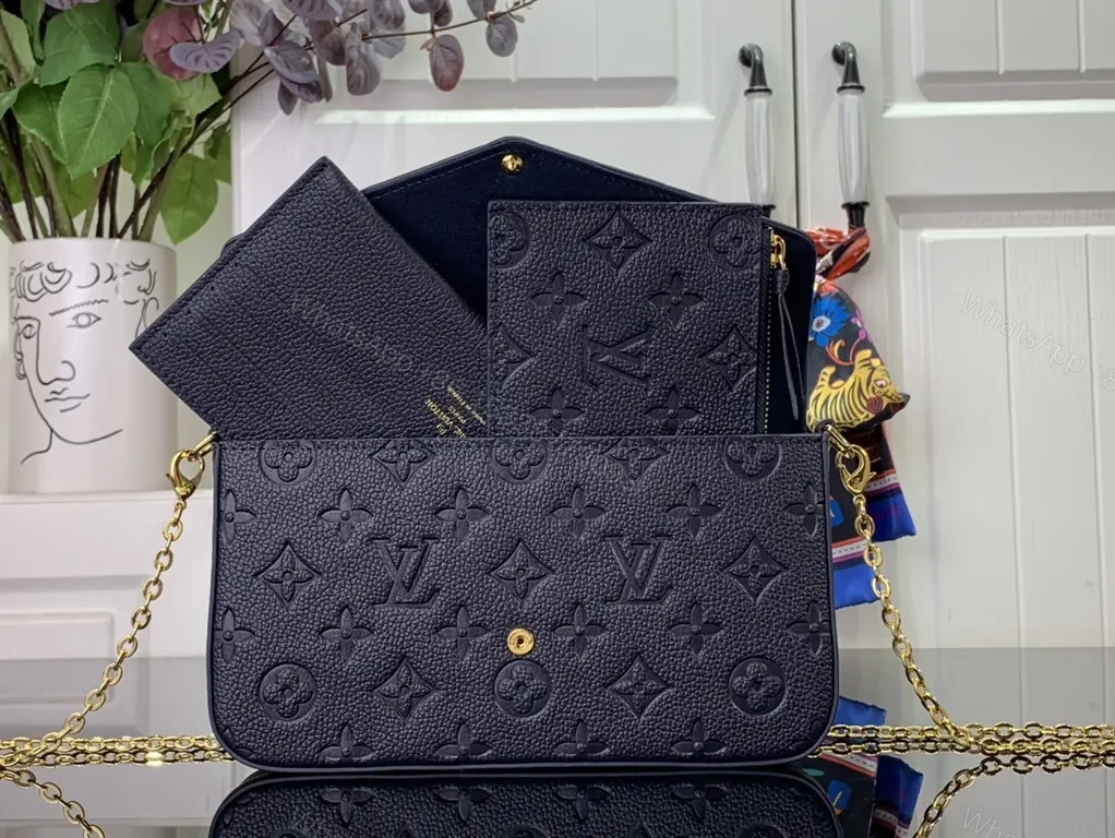 View 9 of Chic Leather Crossbody: Monogram Texture, Gold Hardware, Compact Envelope