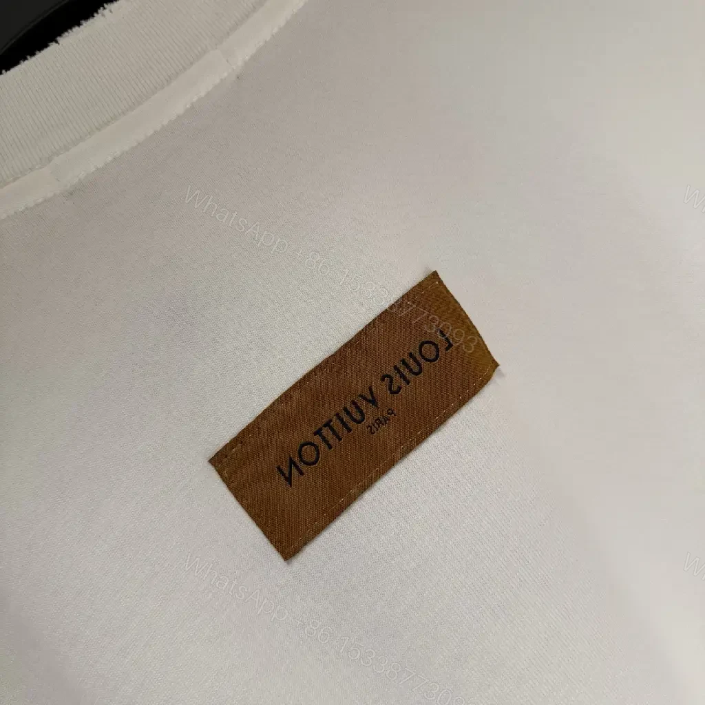 View 5 of White Cotton-Blend Pullover with LV Logo & Architectural Sleeves