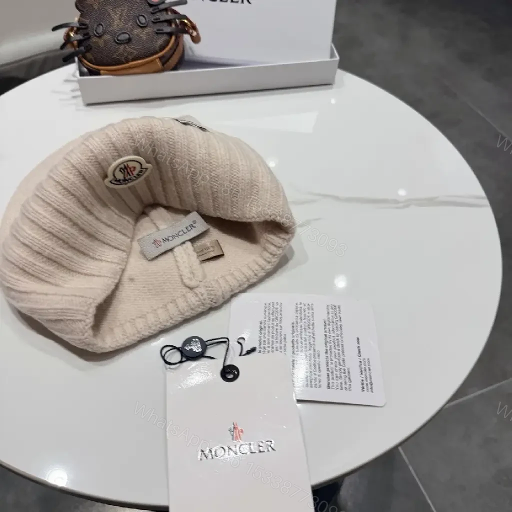 View 3 of Beige Wool Knit Beanie, Subtle Crest, Everyday Luxury