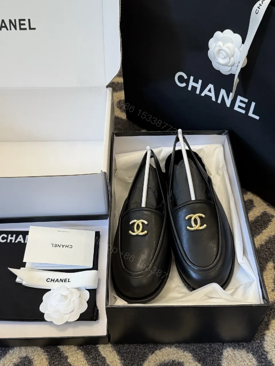 View 3 of Sleek Leather Loafers: Timeless Chic with Gold Logo Hardware