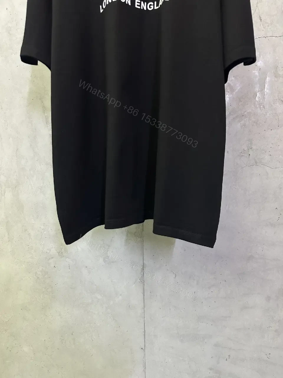 View 6 of Oversized Black Logo Cotton Tee – Modern Streetwear Essential