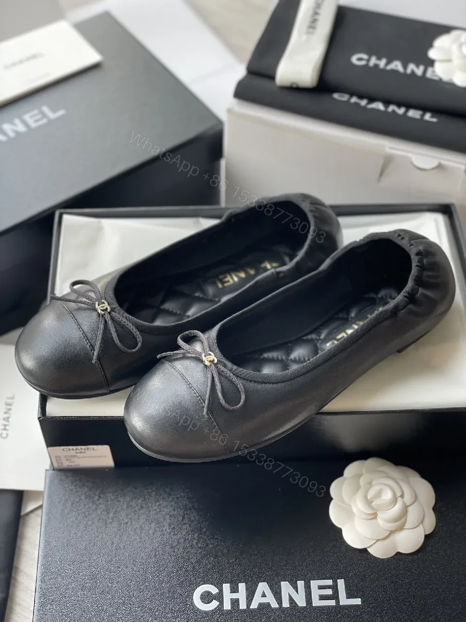 View 2 of Quilted Black Flats with Gold Logo Accents - Chic Comfort