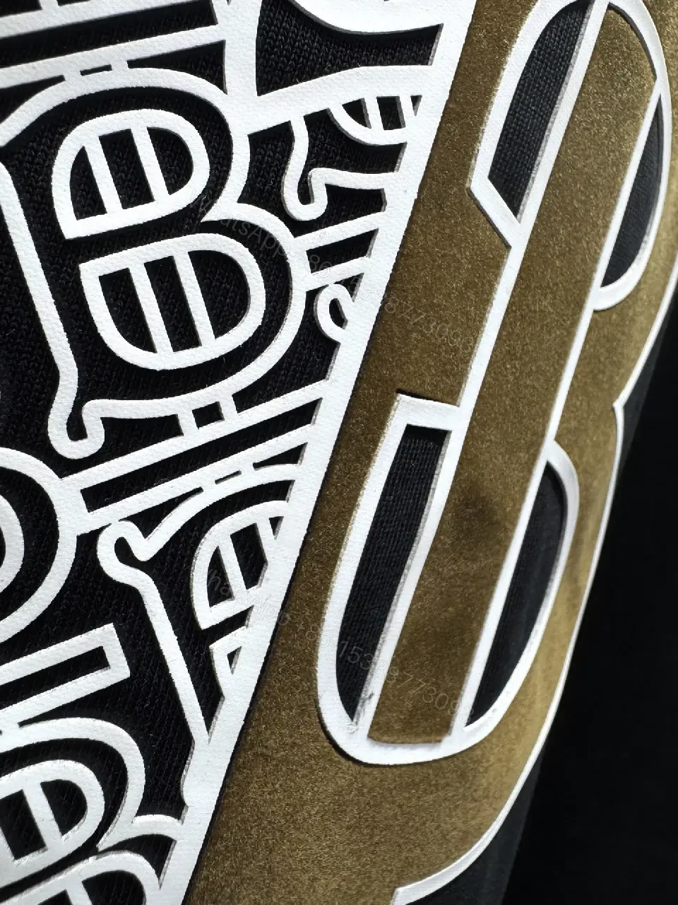 View 8 of Statement Black Cotton Tee with Bold Metallic Logo Detail