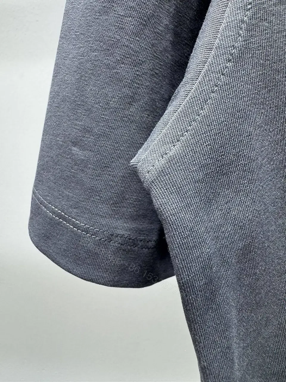 View 4 of Navy Knit Tee: Subtle Crest, Luxe Texture, Relaxed Fit Top