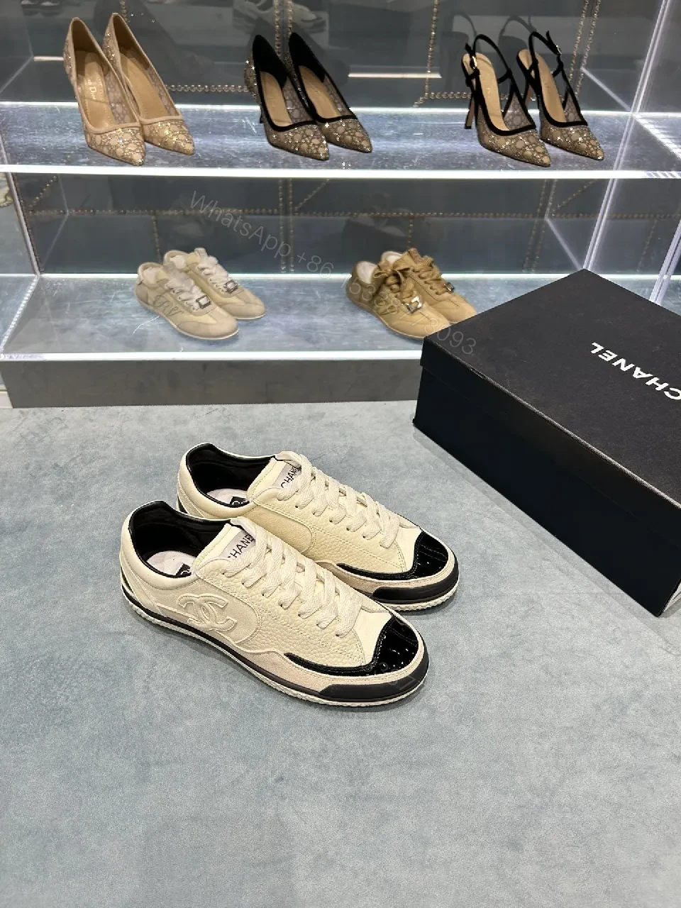 Cream Leather Sneaker + Subtle Chanel-Inspired Detail + High-Top Comfort + Timeless Glossy Toe + Sneaker — view 1