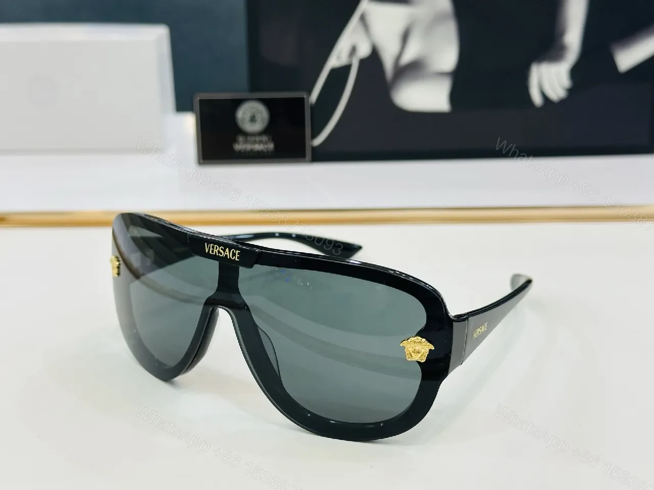 Black Gloss Shield Sunglasses with Gold Emblems, Oversized Style — view 1