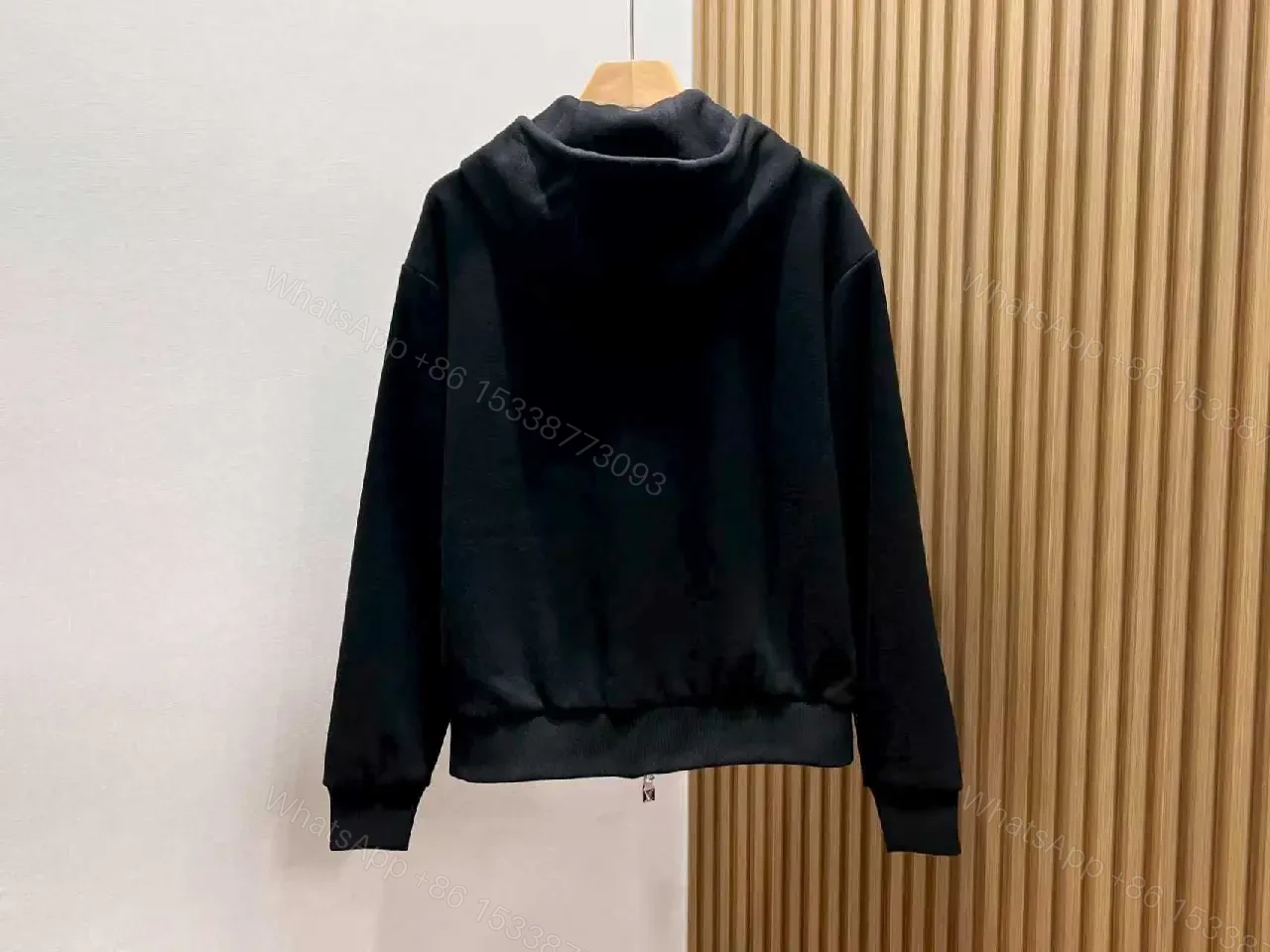 View 3 of Cozy Black Knit Zip Hoodie with Subtle Emblem Embellishment