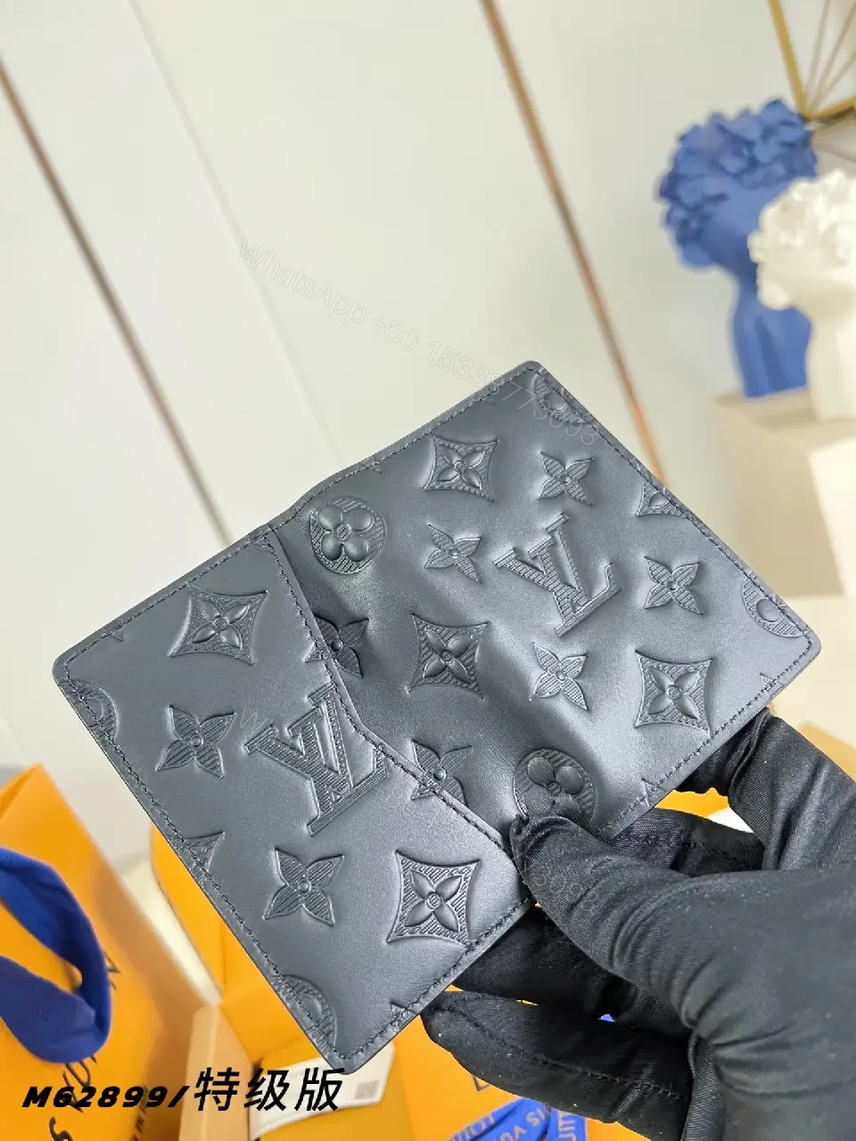 View 4 of Black Leather Slim Bi-Fold Wallet with Embossed LV Pattern
