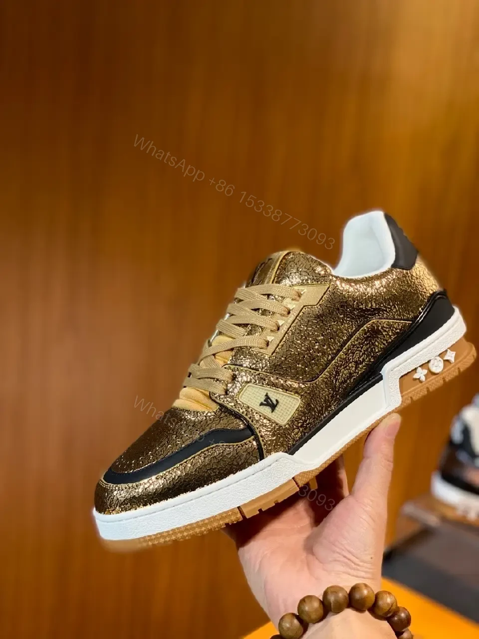 View 4 of Metallic Leather High-Top Sneakers with Subtle LV Detailing