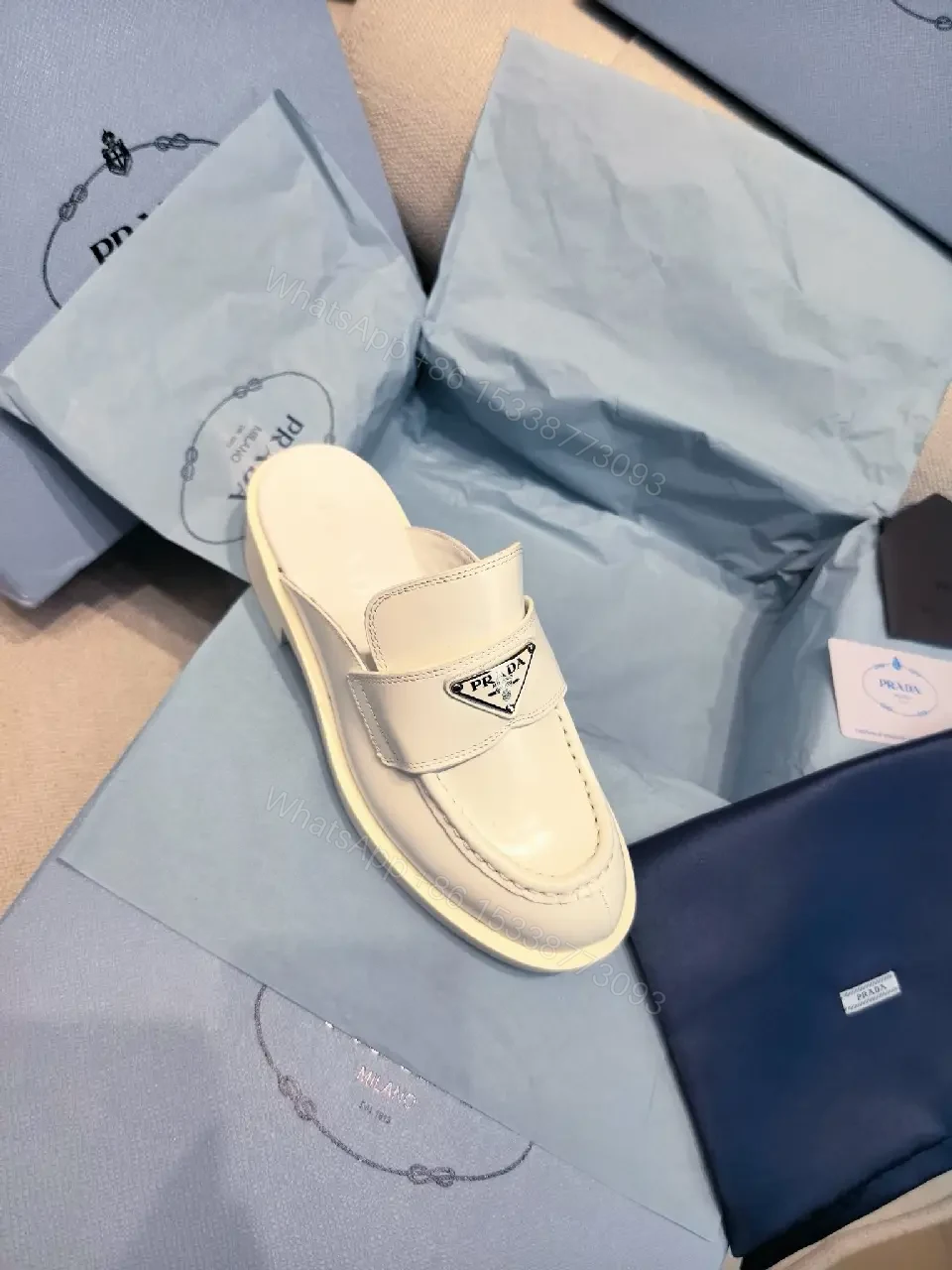 View 9 of White Leather Prada Slip-ons: Classic Padded Comfort Shoes