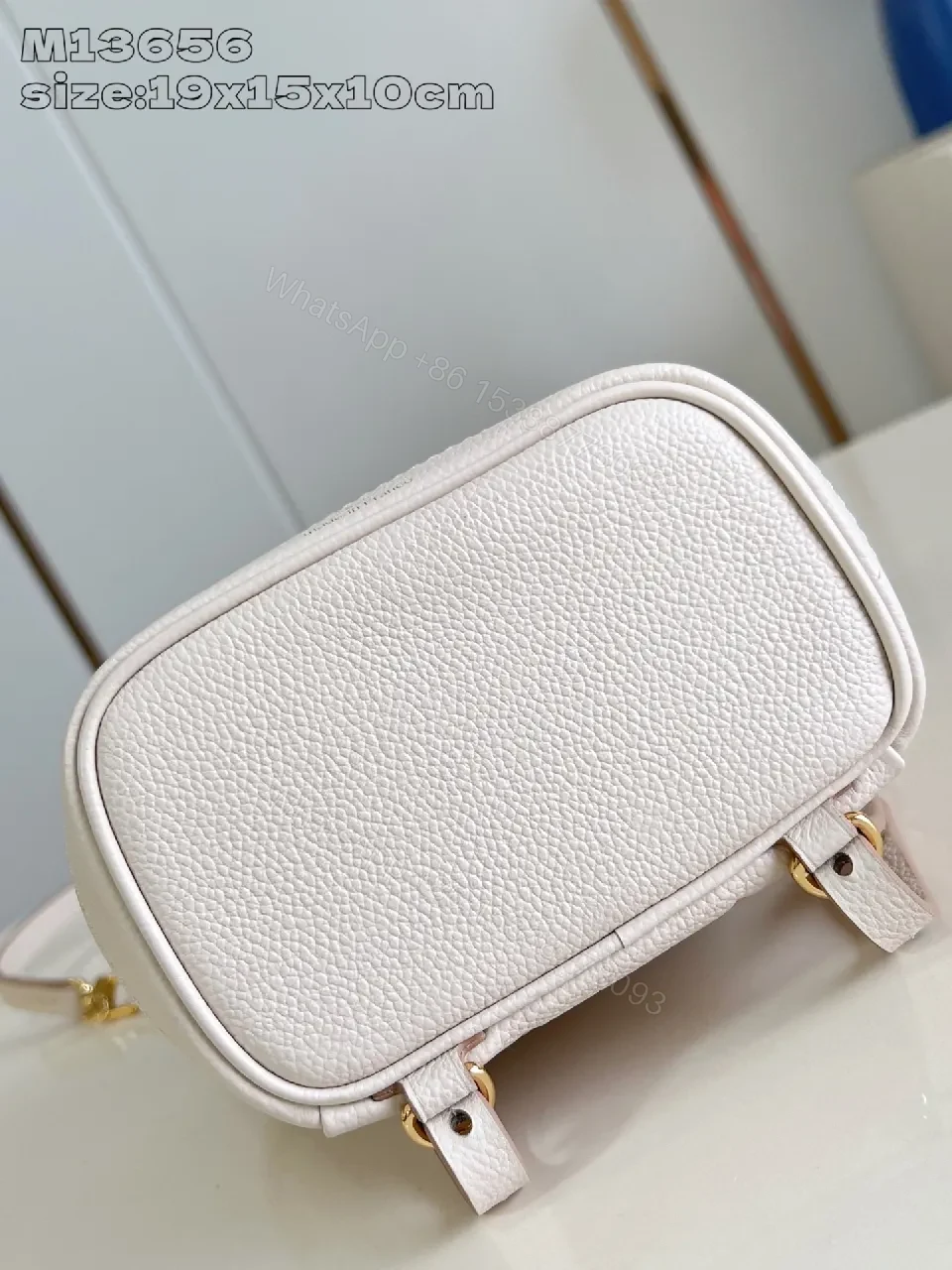 View 3 of Soft Pink Monogram Bucket Bag - Textured Leather, Gold Hardware, Elegant