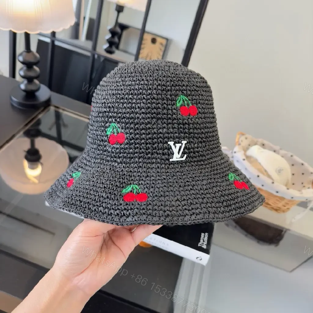 View 3 of Charcoal Crochet Bucket Hat with Cherry & LV Accent