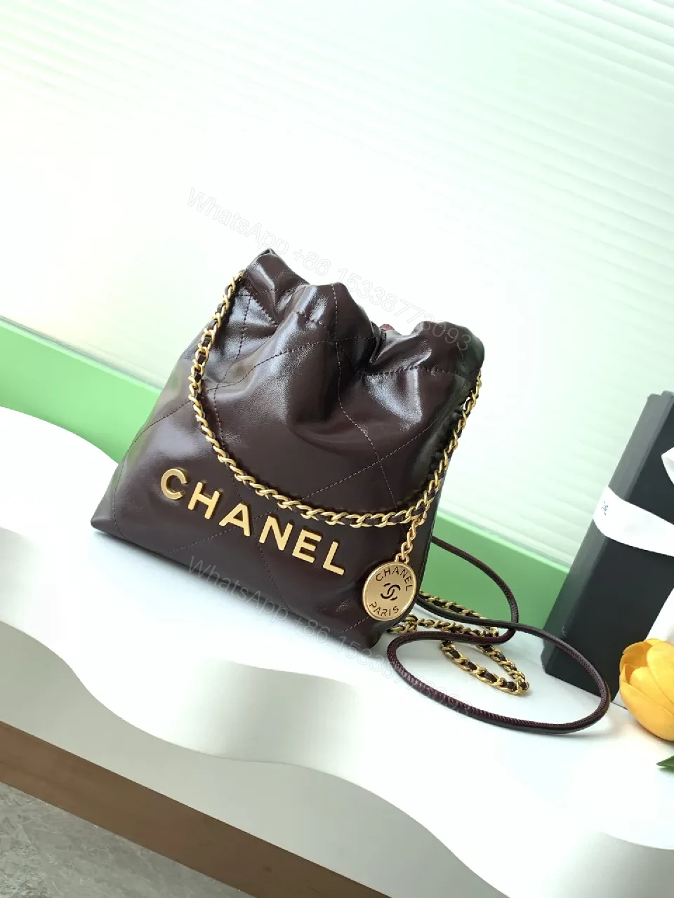 Gold-Traced Quilted Bucket Bag: Luxury Leather, Iconic Hardware — view 1