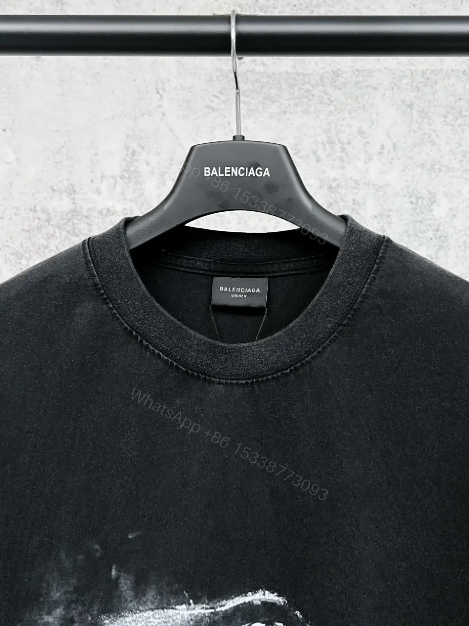 View 7 of Oversized Black Cotton Tee with Distressed Logo – Avant-Garde Streetwear
