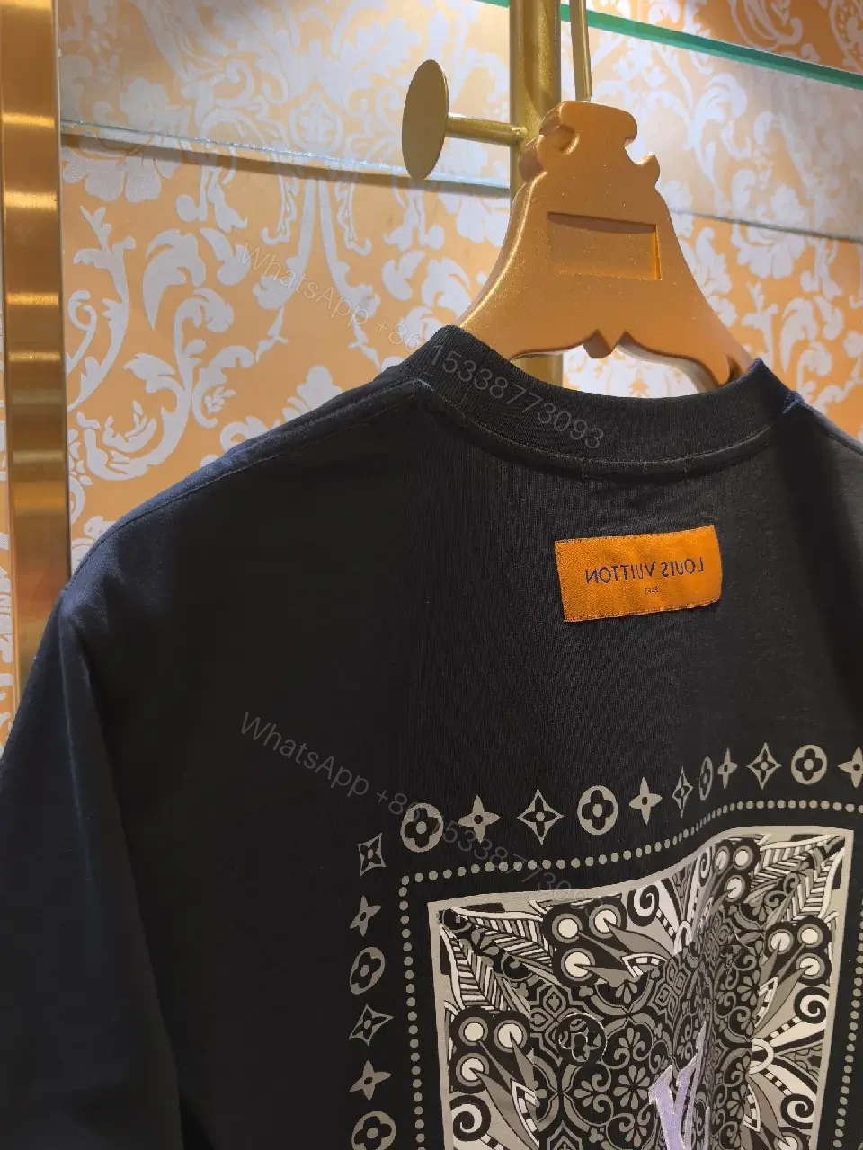 View 7 of Minimalist Black Cotton Tee with Subtle LV Emblem