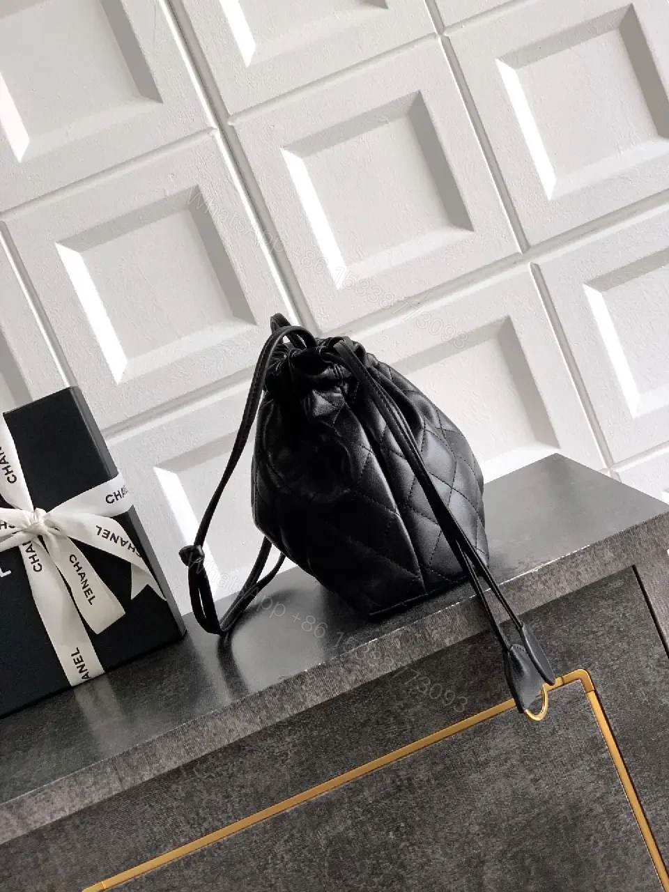 View 3 of Quilted Drawstring Bag - Black Leather-Feel, Gold Accent