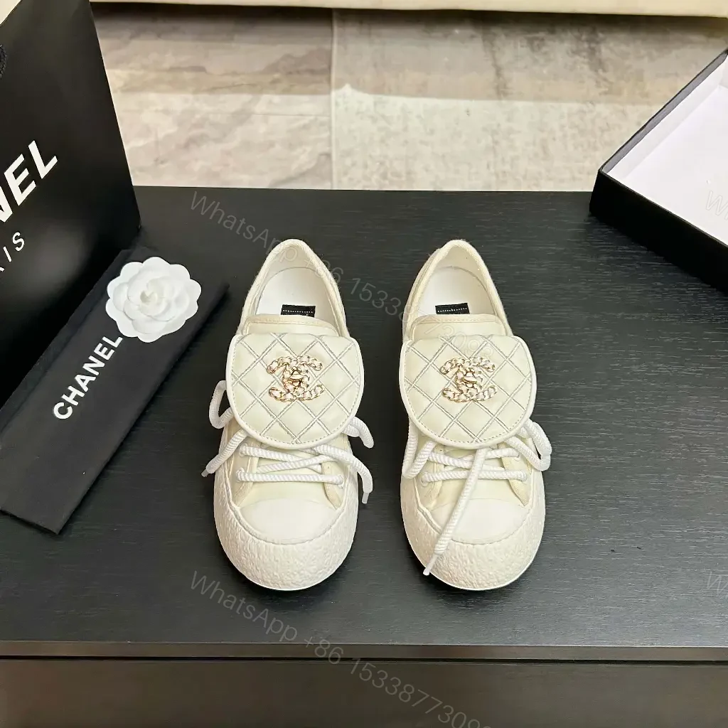 View 2 of Quilted Leather Slip-On Sneakers with Crest Embroidery