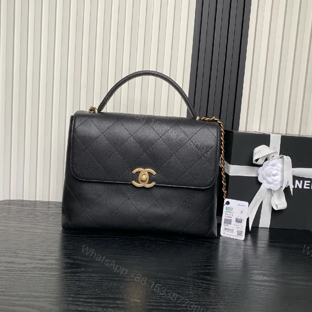 Chic Black Quilted Flap Bag with Gold Logo — view 1