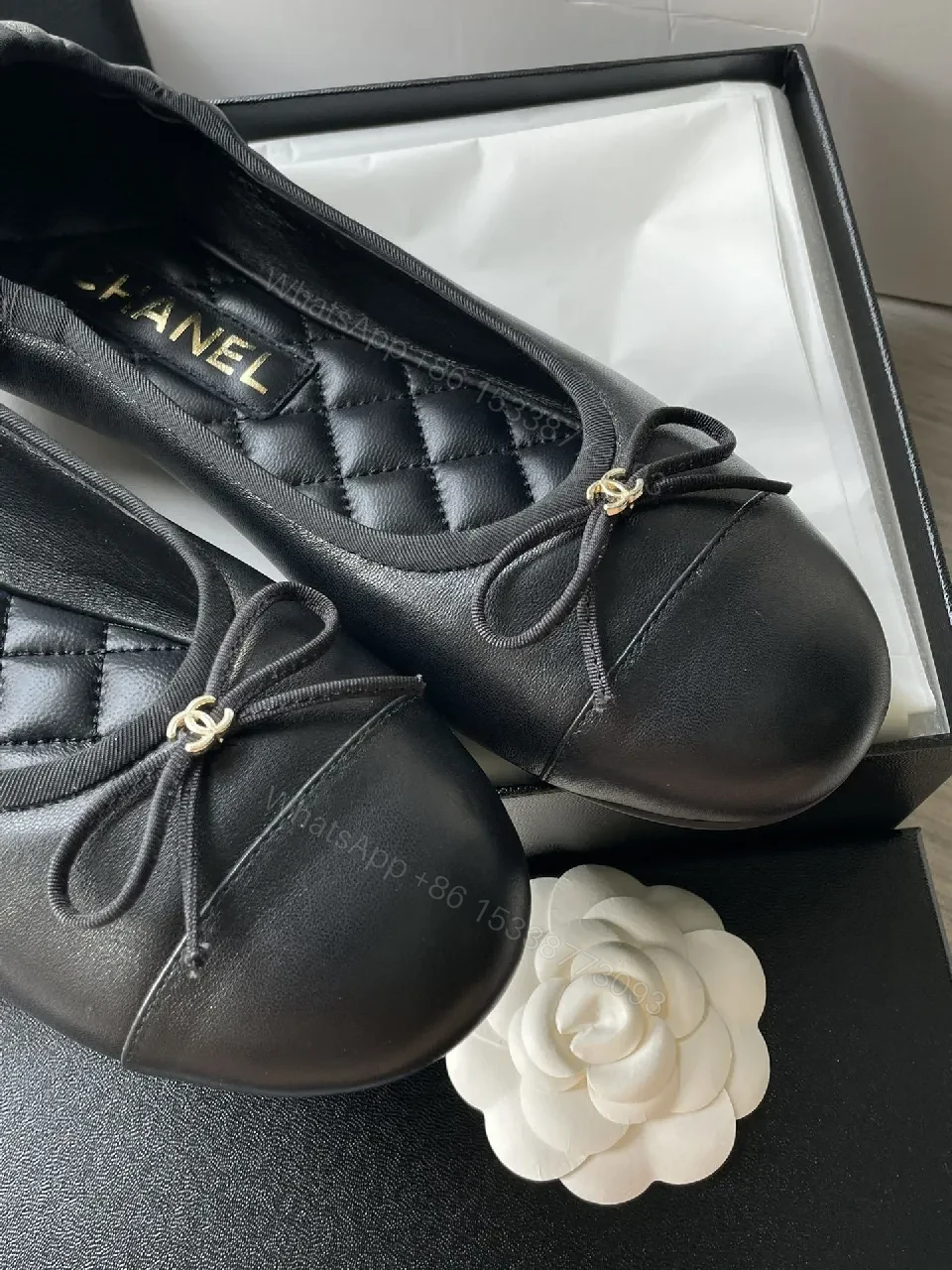 View 4 of Quilted Black Flats with Gold Logo Accents - Chic Comfort