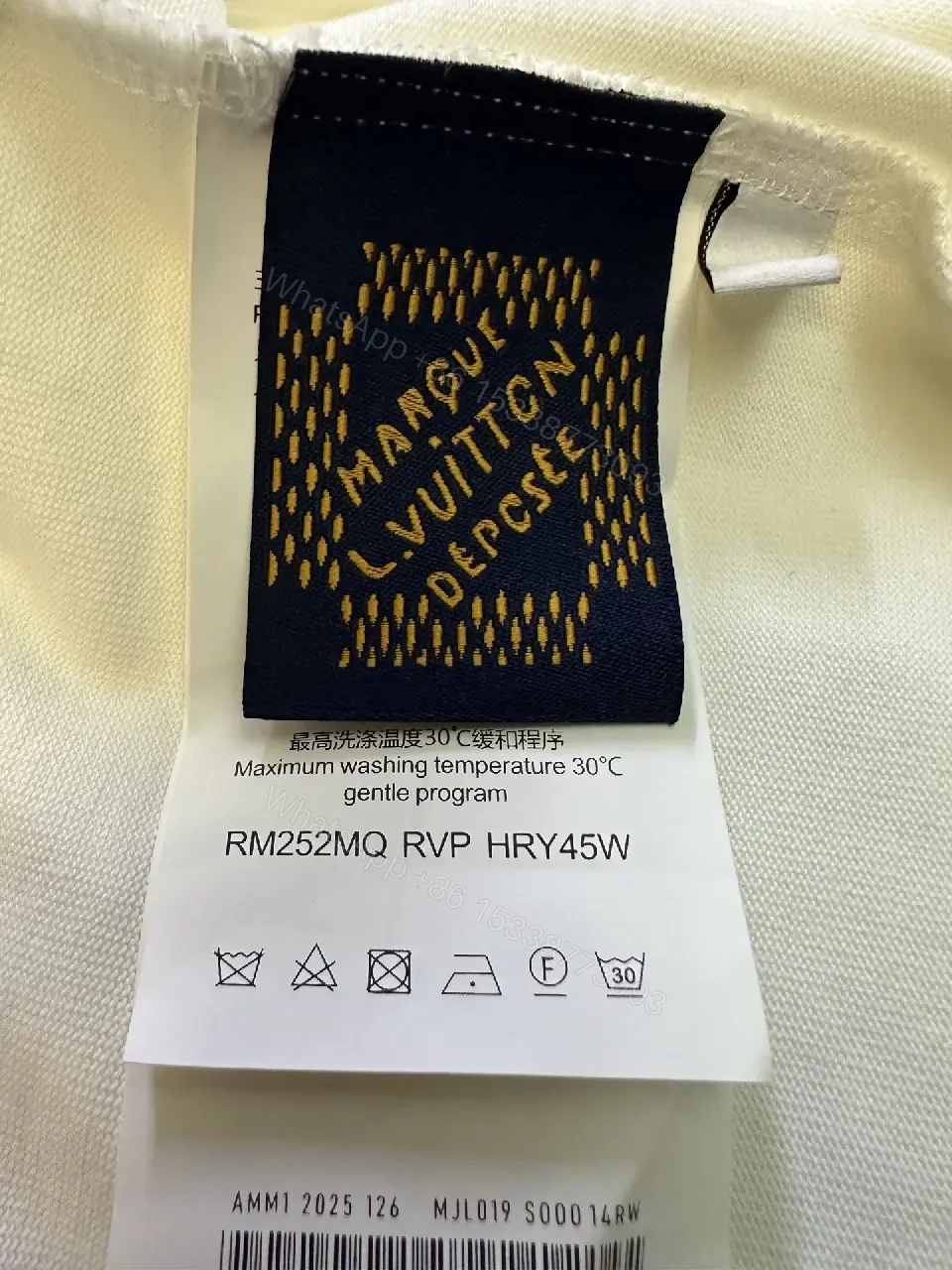 View 10 of Minimalist White Tee with Subtle LV.M. Marking — Premium Everyday Wear