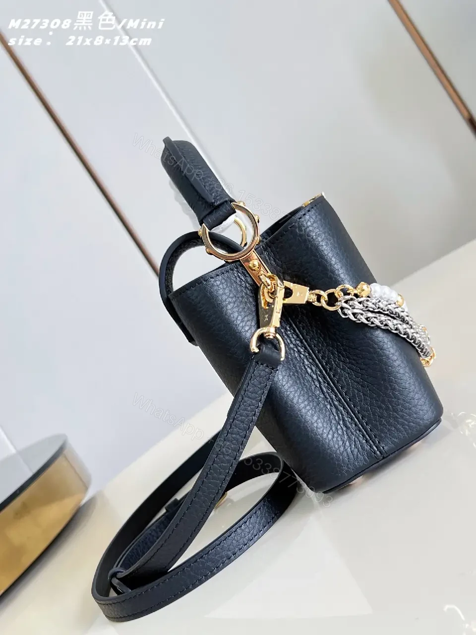 View 7 of Luxurious Mini Bag: Pebbled Leather, Layered Chains, Crossbody Embellishments