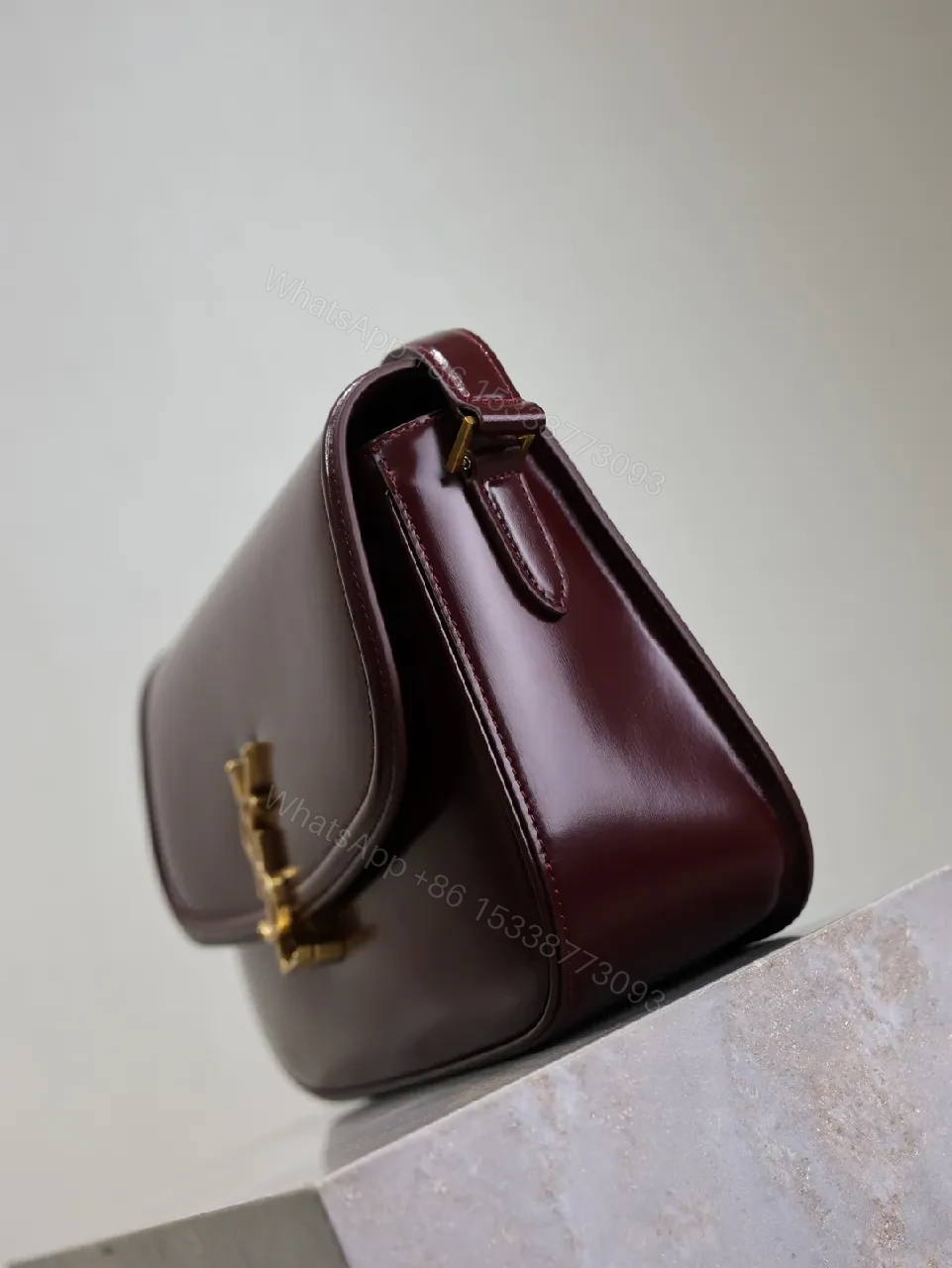 View 8 of Structured Burgundy Leather Crossbody: Gold Logo, Modern Chic