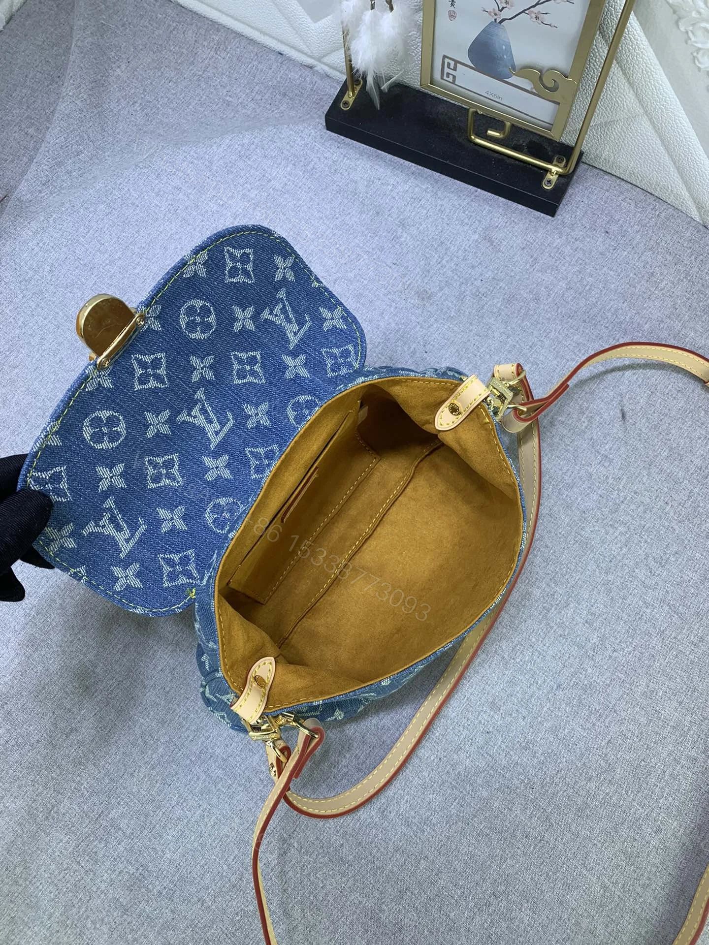 View 4 of Louis Vuitton Pleaty bag in blue denim
