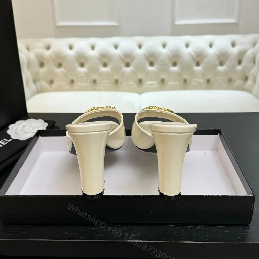 View 3 of White Patent Mules with Gold Logo Embellishment – Sleek Luxury Footwear