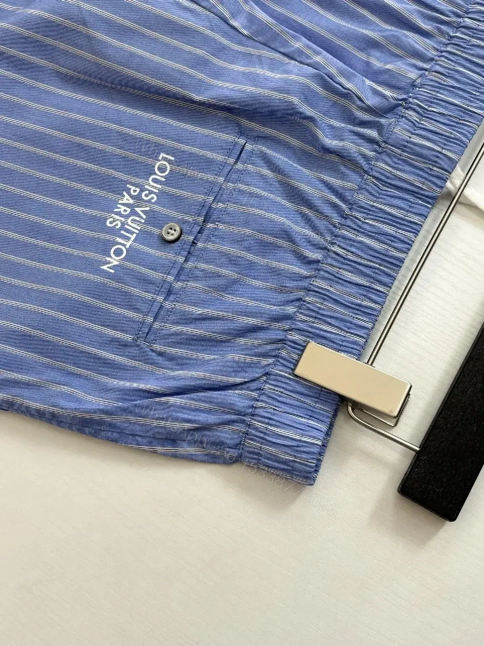 View 9 of Blue Striped Lightweight Drawstring Shorts - Subtle Embossed Logo Luxury