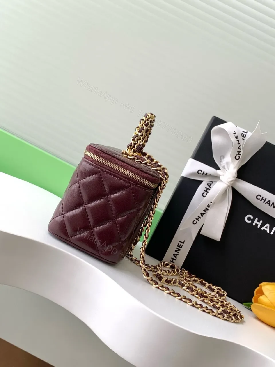 View 5 of Quilted Burgundy Bag with Gold Chain Handle—Compact Luxury