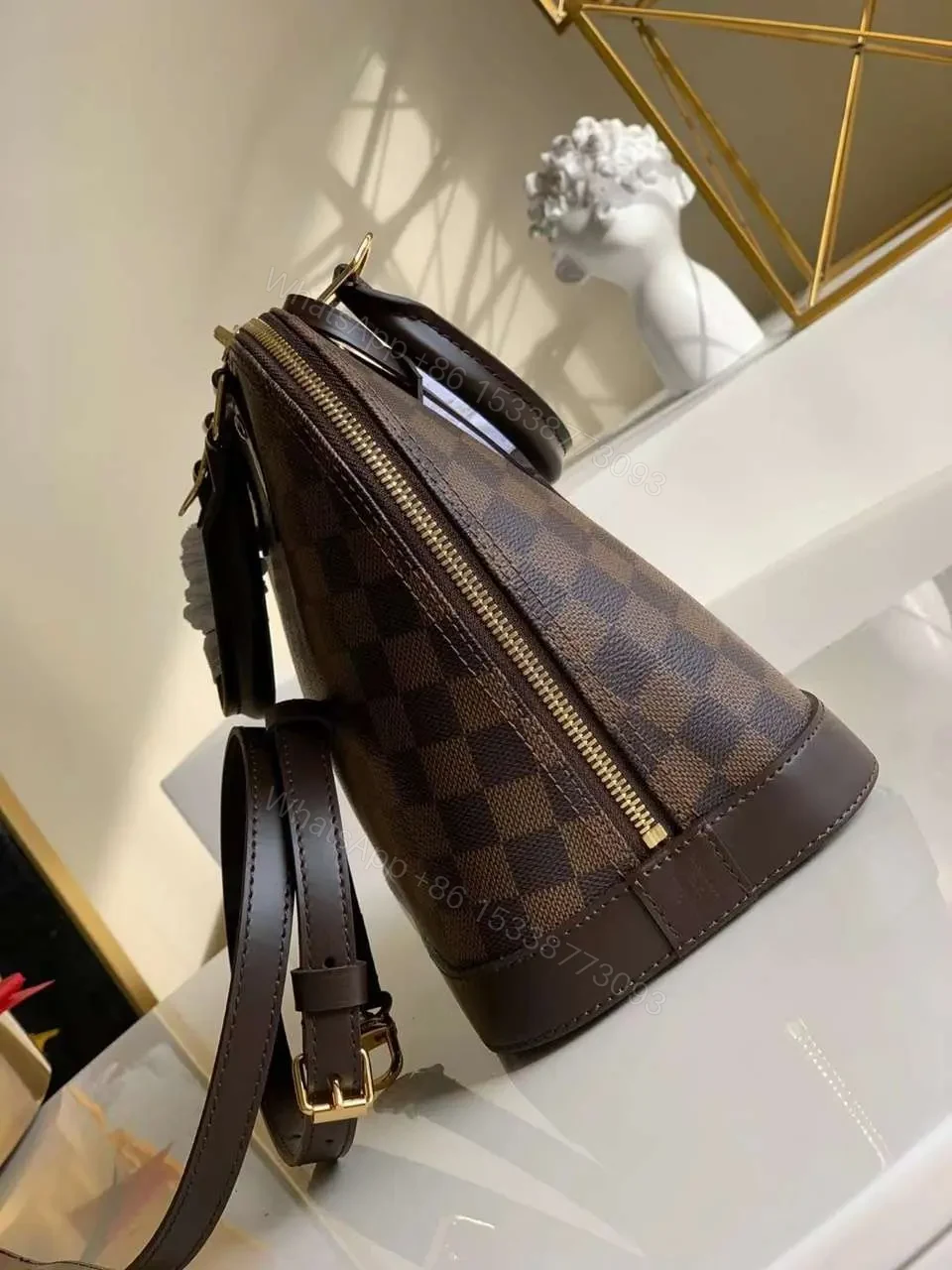 View 2 of Louis Vuitton Damier Ebene Alma PM Caro Pattern Handbags 32mm